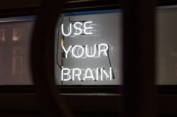 A sign saying 'use your brain'.